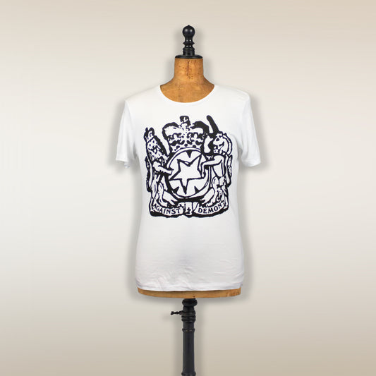 White t-shirt with a black coat of arms design on the front, displayed on a dress form.